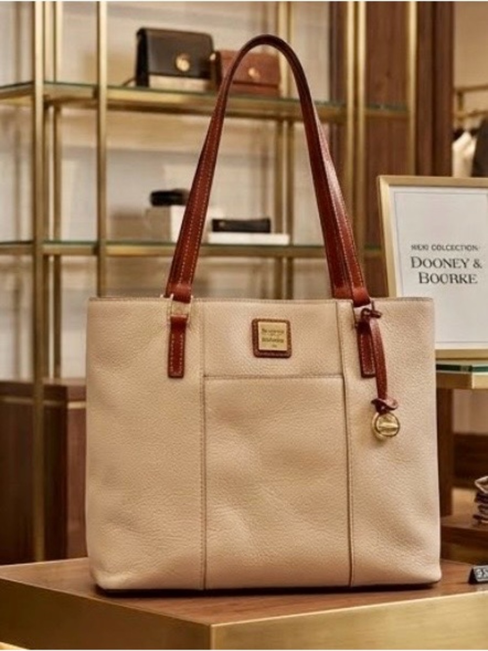Dooney & Bourke Lexington Cream Leather Tote with Brown Trim and Gold Accent